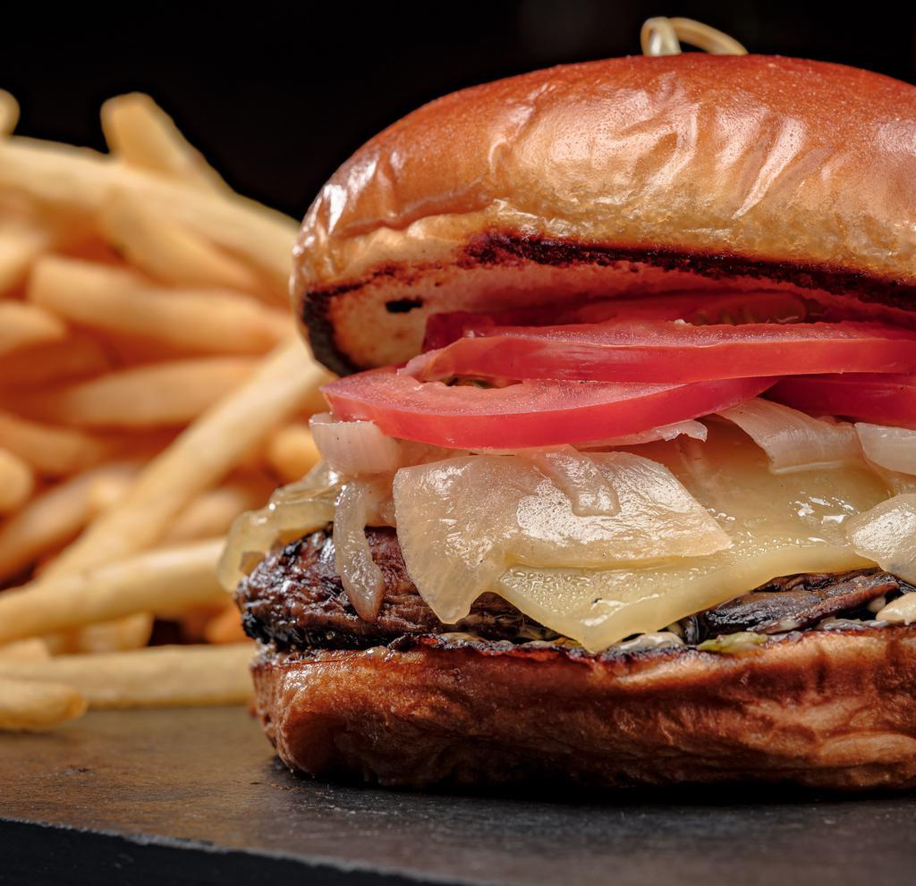 Portabello Mushroom Burger · Large whole Portobello Mushroom grilled and topped with swiss cheese, grilled onions, lettuce, tomatoes, and garlic mayo.  (Vegetarian)
