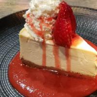 Strawberry Cheesecake · New York Style Cheesecake with strawberry compote sauce.