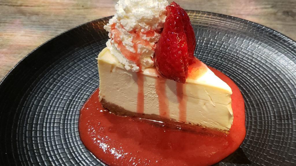 Strawberry Cheesecake · New York Style Cheesecake with strawberry compote sauce.