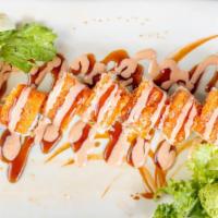 Sp13. Hollywood Roll · Salmon, eel sauce and spicy mayo with shrimp tempura, cucumber and avocado.