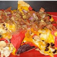 Nacho'S · Tri-color corn chips, Cheddar Cheese, Corn, Black Beans, Pico, Black Olives, and Jalepenos. ...