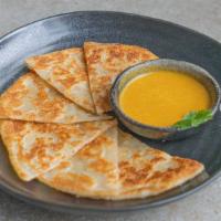 Onion Roti & Yellow Cashew Curry · vegan option by its nature, full of flavor