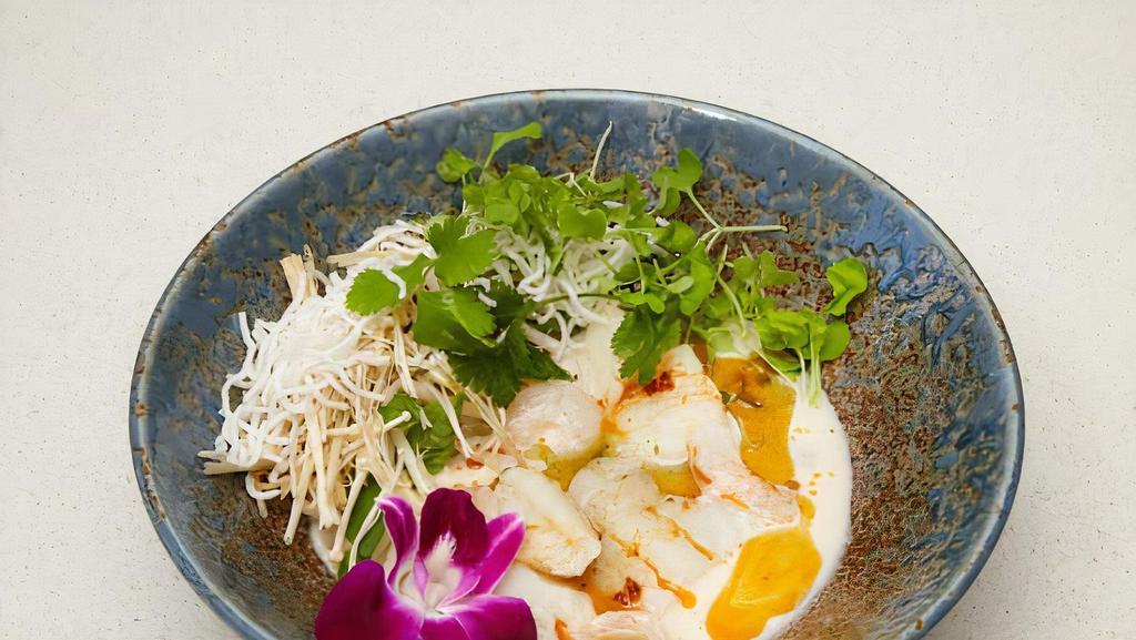 Cod In Coconut Lime Broth · Served with shrimp, basil and crispy rice vermicelli.