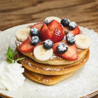 Buttermilk Pancakes · Tender, fluffy pancakes served with fresh fruits, maple syrup.