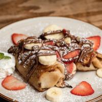 Viva Nutella Crepe · Filled with finely chopped banana, strawberry blended with Nutella and topped with chocolate...