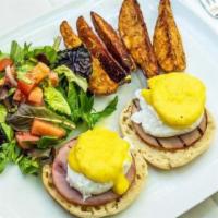 Canadian Benedict · Poached eggs, Canadian ham and Hollandaise sauce on English muffin.