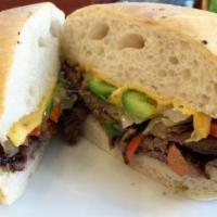 Steak & Cheese Sandwich · Hanger steak topped with sautéed onions, mushrooms, green and red bell pepper and American c...
