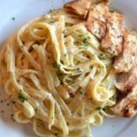 Chicken Fettuccine Alfredo · Fettuccine pasta blended with a homemade Alfredo sauce topped with sliced grilled chicken.