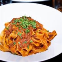 Pappardelle With Beef Rague · Pappardelle pasta blended with rich beef ragu sauce.