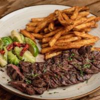 Grilled Skirt Steak & Fries  · Marinated sliced skirt steak, grilled to perfection.
Served with French Fries, Brussels spro...