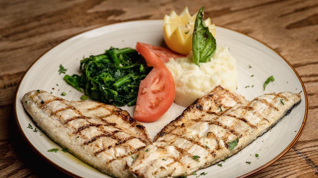 Grilled Branzino Fillet · Grilled Mediterranean Sea bass,
Served with mashed potato & broccoli rabe.