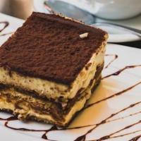Homemade Tiramisu · Layers of espresso drenched sponge cake divided by mascarpone cream, dusted with cocoa powder.