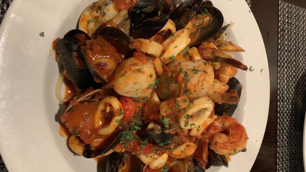 Seafood Fra Diavolo · Shrimp, scallops, clams, mussels, calamari, linguine and tomato sauce mild, medium or hot.