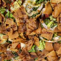 Fattoush · Garden salad, oil vinegar and fried bread.