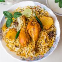 Chicken Biryani · Fluffy, basmati rice cooked with tender chicken and aromatic whole spices including cinnamon...