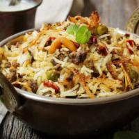 Lamb Biryani · Fluffy, basmati rice cooked with tender lamb chunks and aromatic whole spices including cinn...