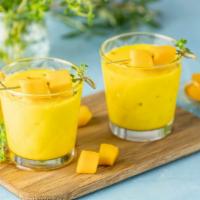 Mango Lassi · Sweet, thick and creamy chilled yogurt drink blended with sweet, ripe mangoes.