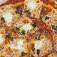 Semolina Margherita Pizza · Semolina crusted dough, fresh plum ,homemade mozzarella,basils, leaves,extra virgin olive oil.