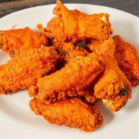 Wings · Our famous wings are always a hit, breaded & dry spiced with hot sauce and blue cheese dress...