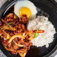 Jaeyook Chulpan · Steamed rice topped with spicy pork belly.