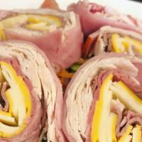 Chef’S Salad · Sliced turkey, ham, roast beef, Swiss and American cheeses and hard-boiled egg over a garden...