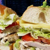 Classic Chicken Sandwich · House marinated grilled or breaded chicken breast, lettuce, and tomato served with mayo on t...