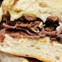 French Dip · Hot, succulent roast beef topped with mozzarella cheese and served with au jus.