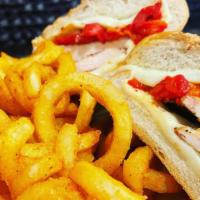 Roma Sandwich · Grilled chicken breast, mozzarella cheese, and roasted red peppers.