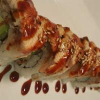 Black Dragon Roll · Inside spicy shrimp, crab stick and mango, outside eel, avocado and eel sauce and masago.