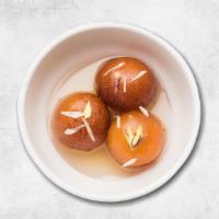 Gulab Jamun · Two pieces. Soft delicious berry sized balls made of milk solids, flour & a leavening agent.