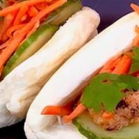 Bonmi Bao · 2 Fluffy Bao with your choice of Protein, with Spicy Mayo, Pickled Carrots, Cucumber & Cilan...