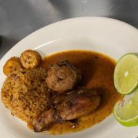 Locrio De Chuelta/ Porkchop Mixed With Rice · Con Arroz y habichuelas/ With Rice and Beans