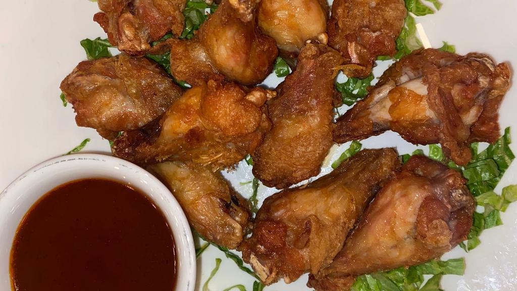 Chicken Wings · 12 wings cooked in choice of BBQ or Buffalo sauce