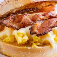 Bacon, Egg & Cheese Sandwich · Fresh, fluffy scrambled eggs and crispy smoky bacon with melty cheese on a toasted, buttery ...