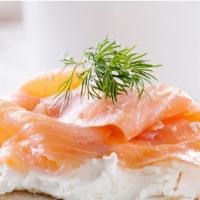 Smoked Salmon Sandwich · Delicious Breakfast sandwich with Smoked Salmon, Cream cheese and red onions, served on a cr...
