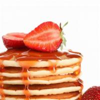 Strawberry Pancakes · Delicious, hot buttermilk pancakes cooked to perfection. Topped with fresh strawberries.