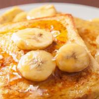 French Toast With Banana Slices · Delicious, hot buttermilk pancakes cooked to perfection. Topped with fresh banana slices.
