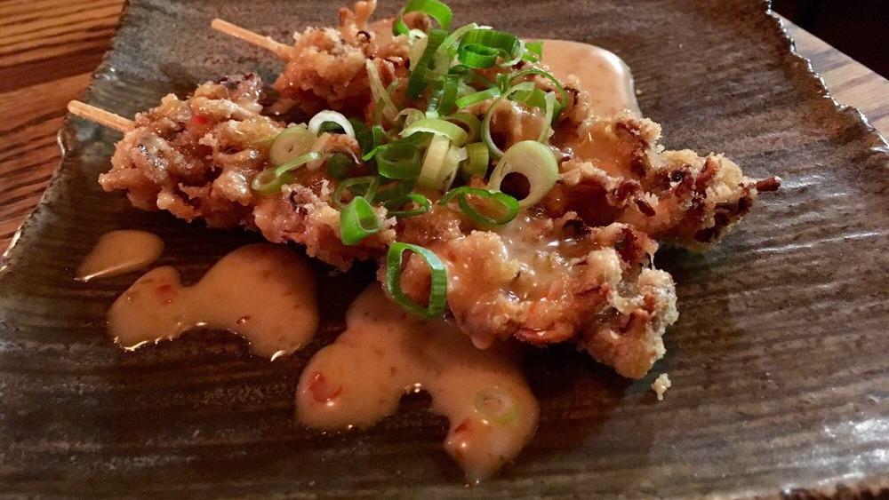 Squid Tentacle On Skewer · Served with sweet chili sauce.