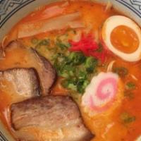 Spicy Tonkotsu Ramen · Pork belly, 1/2 soft boiled egg, bamboo shoot, scallion, fish cake, black garlic oil, pork b...