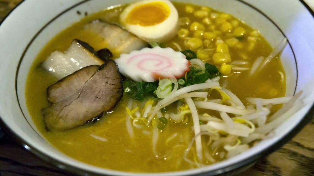 Miso Ramen · Pork belly, 1/2 soft boiled egg, scallion, fish cake, corn, bean sprouts, pork broth and thin noodles.