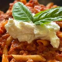 Penne Bolognese · Gluten-free available. Penne pasta in a creamy meat sauce.