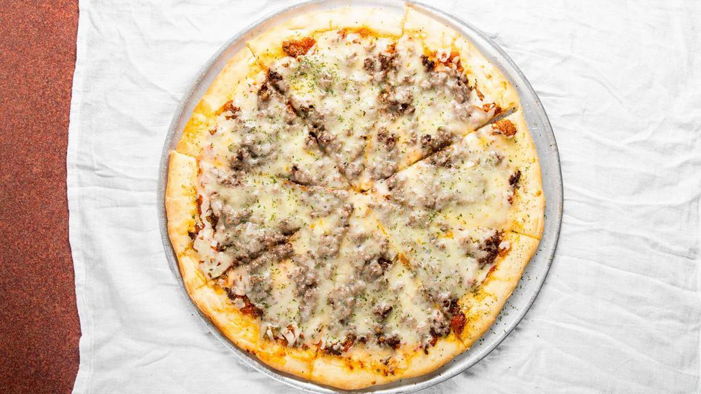 Philly Steak Pizza · Shaved steak with sweet peppers, onions, Swiss and provolone cheese on a white crust, served with boss sauce.
