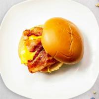 Baconator Sandwich · Scrambled egg, bacon, cheddar cheese, sliced tomato and caramelized onions.