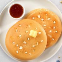 White Chocolate Pancakes · Fluffy white chocolate chip pancakes cooked with care and love served with butter and maple ...