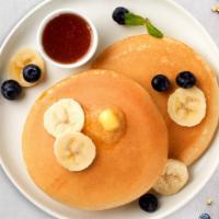 Banana Berry Pancakes · Fluffy banana and berries pancakes cooked with care and love served with butter and maple sy...