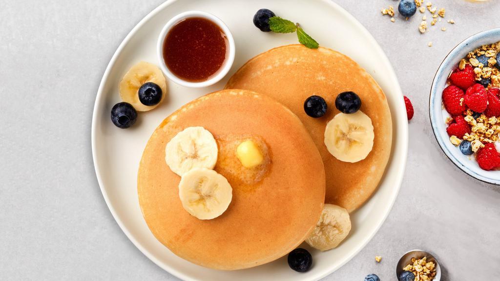Banana Berry Pancakes · Fluffy banana and berries pancakes cooked with care and love served with butter and maple syrup. Served in pairs.