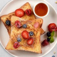 Berry French Toast · Fresh bread battered in egg, milk, and cinnamon cooked until spongy and golden brown. Topped...