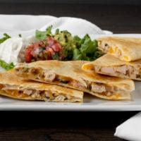 Chicken Quesadilla · Marinated and grilled chicken with cheddar and mozzarella. cheese. Grilled flour tortillas s...