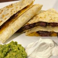 Steak Quesadilla · Marinated sliced steak with cheddar and mozzarella cheese.. Grilled flour tortillas. Served ...