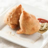 Samosa · 2 pieces. Crispy fried turnovers deliciously filled with peas & potatoes.